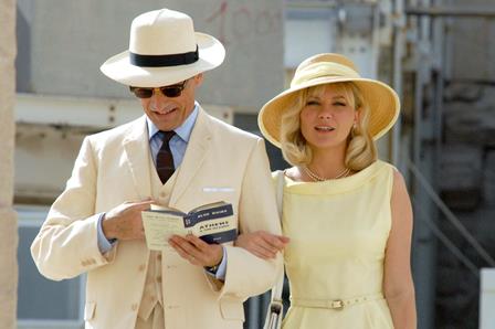 Kirsten-Dunst-yellow-dress-and-hat-working-on-The-Two-Faces-of-January05